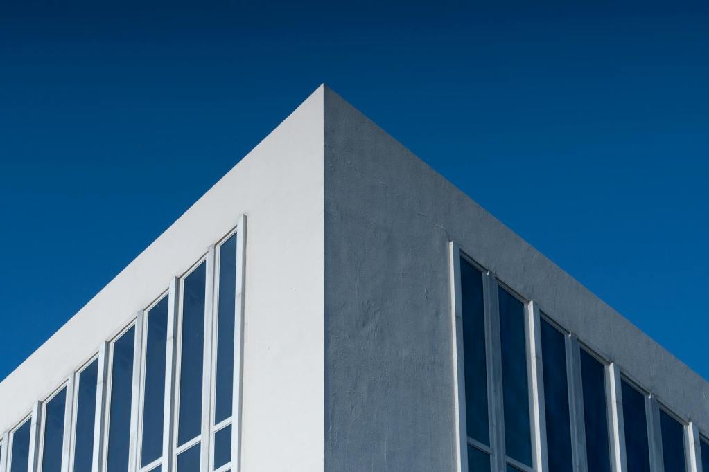 modern minimalist building against clear blue sky